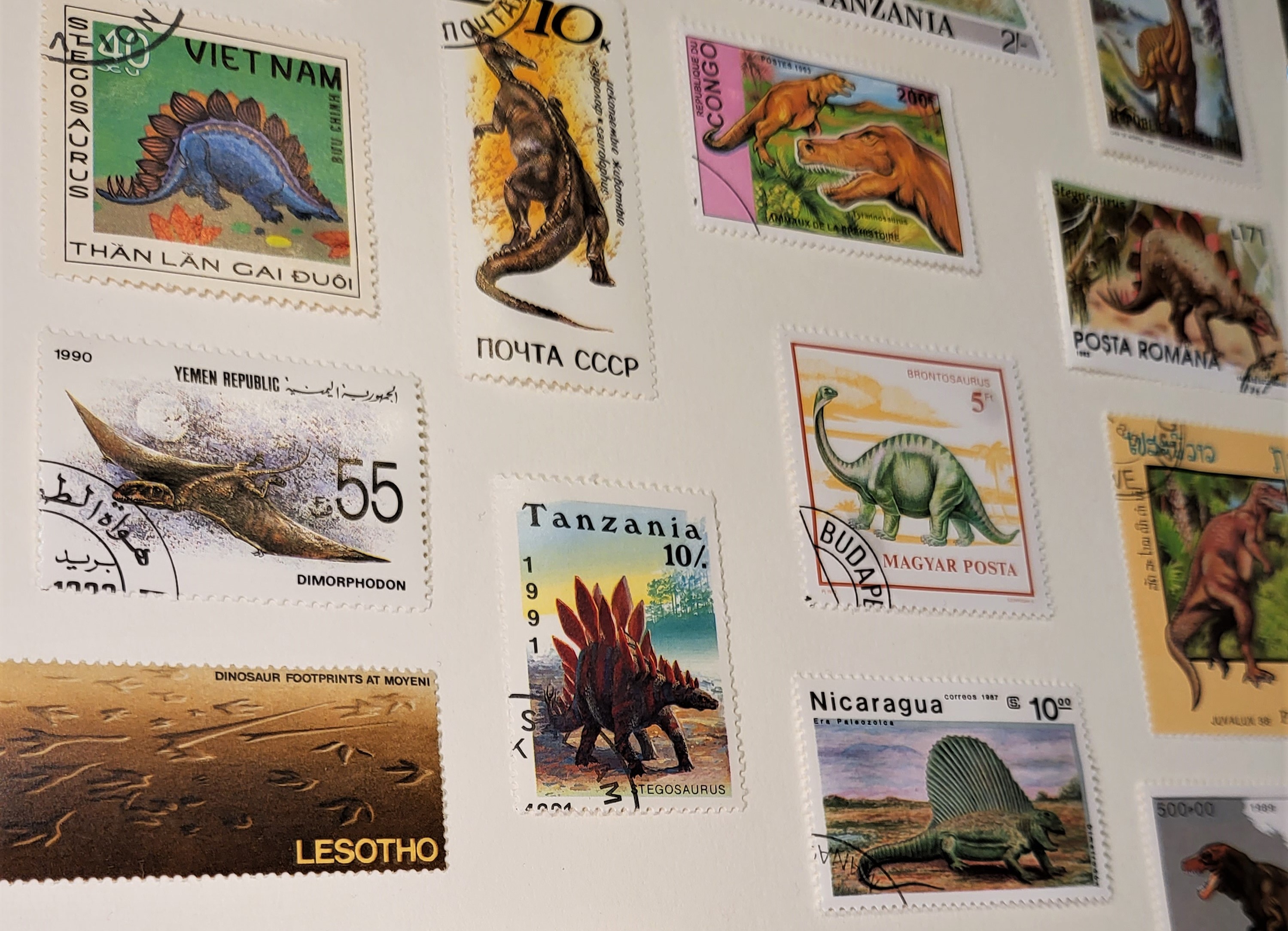 Selection of stamps from Lesotho, Nicaragua and more, featured in our Dinosaurs in the Post presenting case.