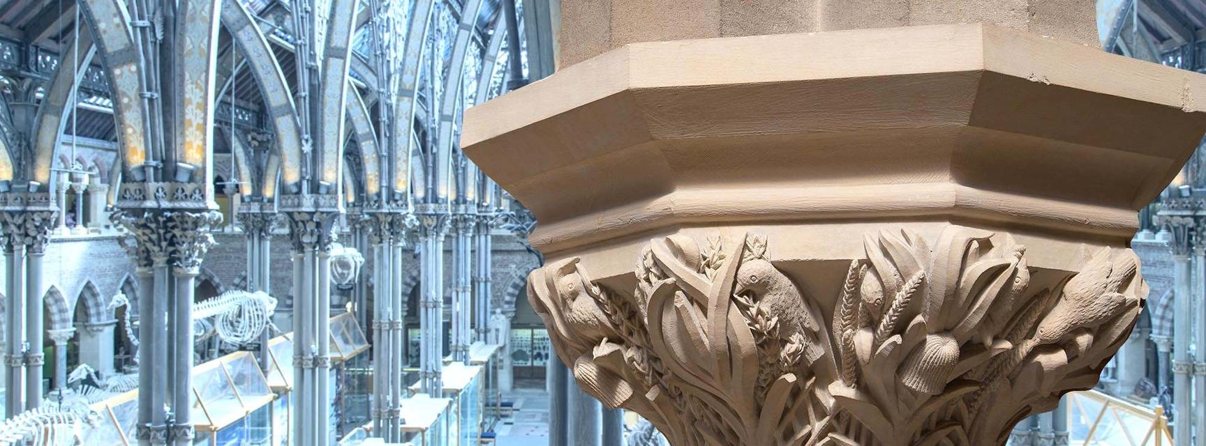 A carved column in the Museum featuring birds picking at grain