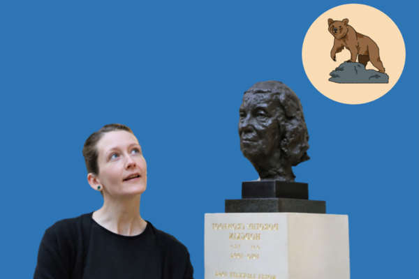 Research scientist Dr Elsa Panciroli looking at a bust of Dorothy Hodgkins