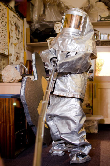 Person in a shiny silver volcanologist suit